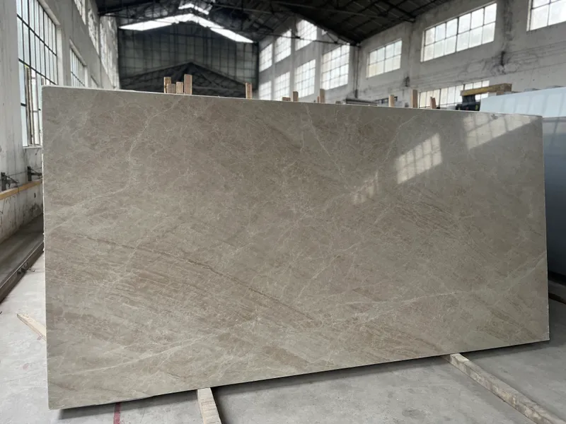 Warm grey slab leaning on a frame inside a large workshop
