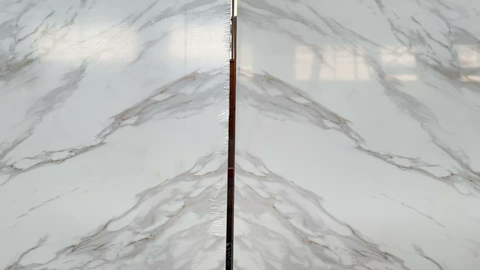 Close-up of two slabs set side by side so the veining meets at the joint